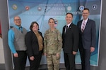 Winners of the 57th Annual Employee Recognition Awards Program stand with the command team