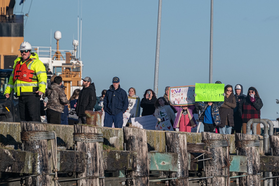 Friends and family members of the crew of U.S. Coast Guard Cutter John Witherspoon (WPC 1158) welcome them to thier homeport in Kodiak, Alaska, Jan. 28, 2025.