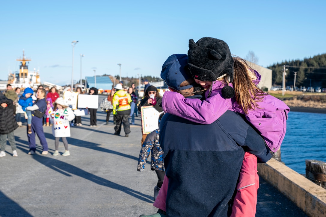 Friends and family members of the crew of U.S. Coast Guard Cutter John Witherspoon (WPC 1158) welcome them to thier homeport in Kodiak, Alaska, Jan. 28, 2025.