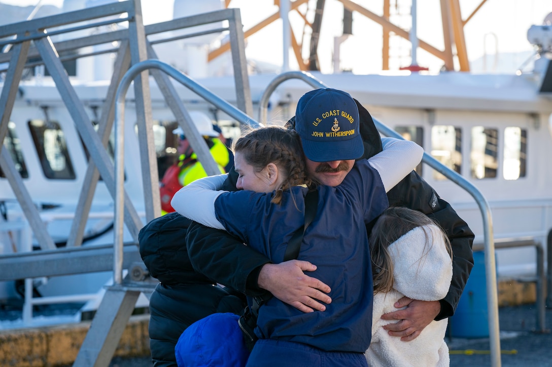 The families and friends members of the crew of U.S. Coast Guard Cutter John Witherspoon (WPC 1158) welcome them to their homeport in Kodiak, Alaska, Jan. 28, 2025.