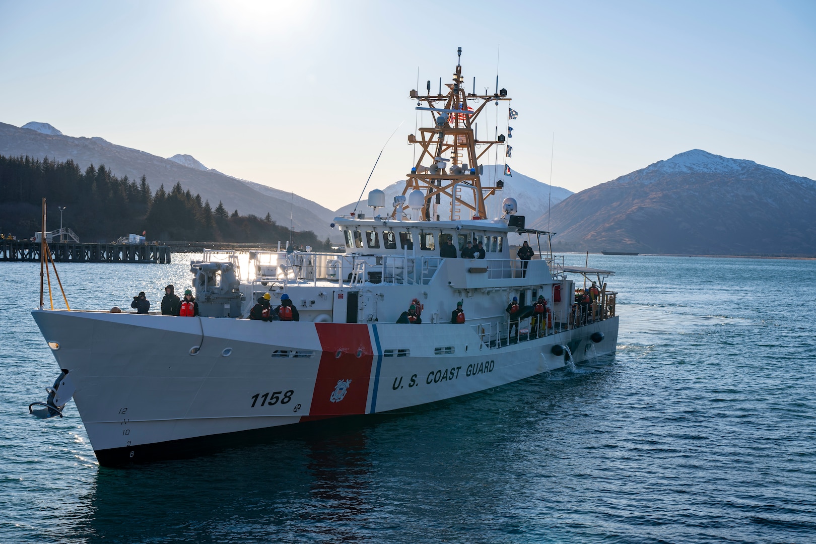 The crew of U.S. Coast Guard Cutter John Witherspoon (WPC 1158) arrives to their homeport in Kodiak, Alaska, aboard their cutter for the first time, Jan. 28, 2025.