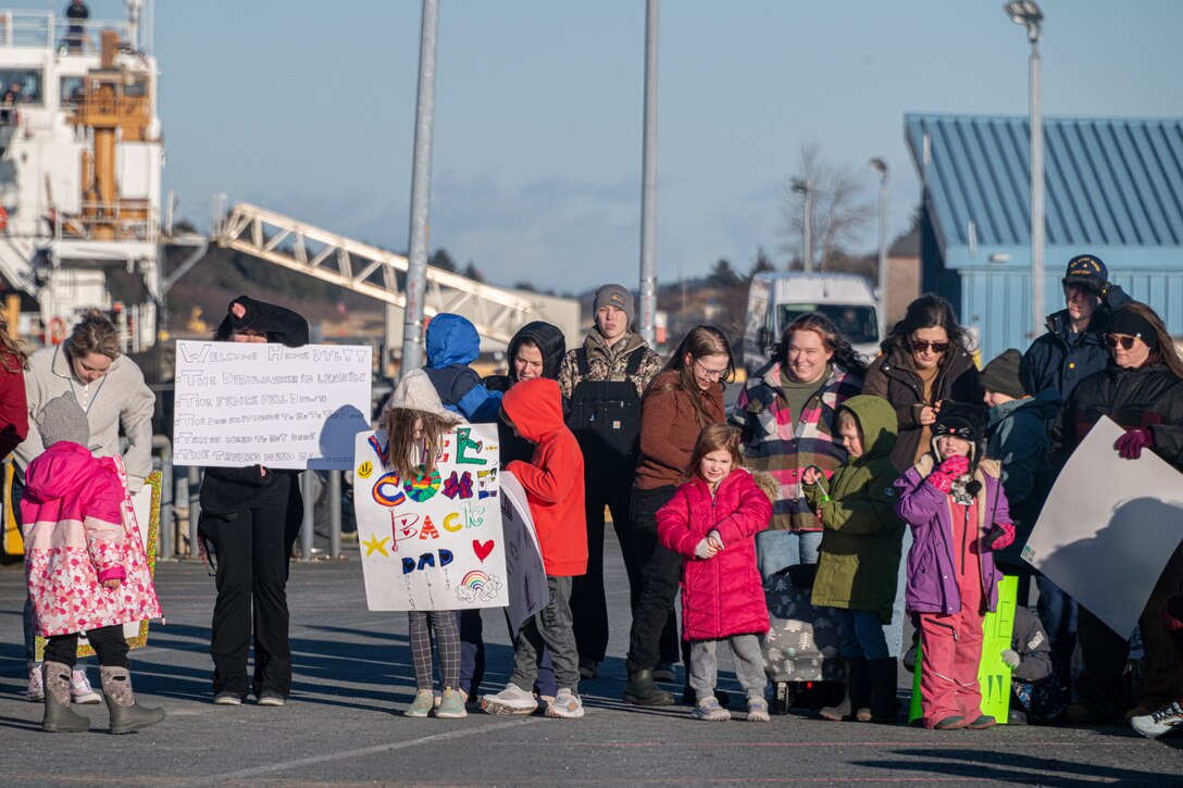 Friends and family members of the crew of U.S. Coast Guard Cutter John Witherspoon (WPC 1158) welcome them to thier homeport in Kodiak Alaska, Jan. 28, 2025.