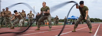 OKINAWA, Japan (Jan. 23, 2025) — U.S. Marines and Sailors with Marine Corps Installations Pacific use the battle ropes during the Pacific Iron Challenge on Camp Hansen, Okinawa, Japan, Jan. 23, 2024. During the event, Marines and Sailors with MCIPAC competed against each other in three high intensity events improving morale and increasing unit cohesion. Shin is a native of Utah and Bista is a native of Ohio. (U.S. Marine Corps photo by Lance Cpl. Brody Robertson)