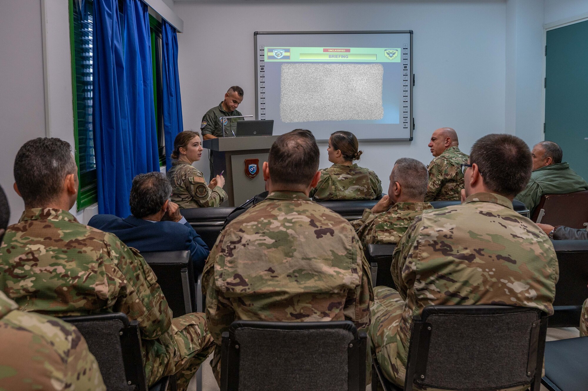 Air advisor speaks during meeting
