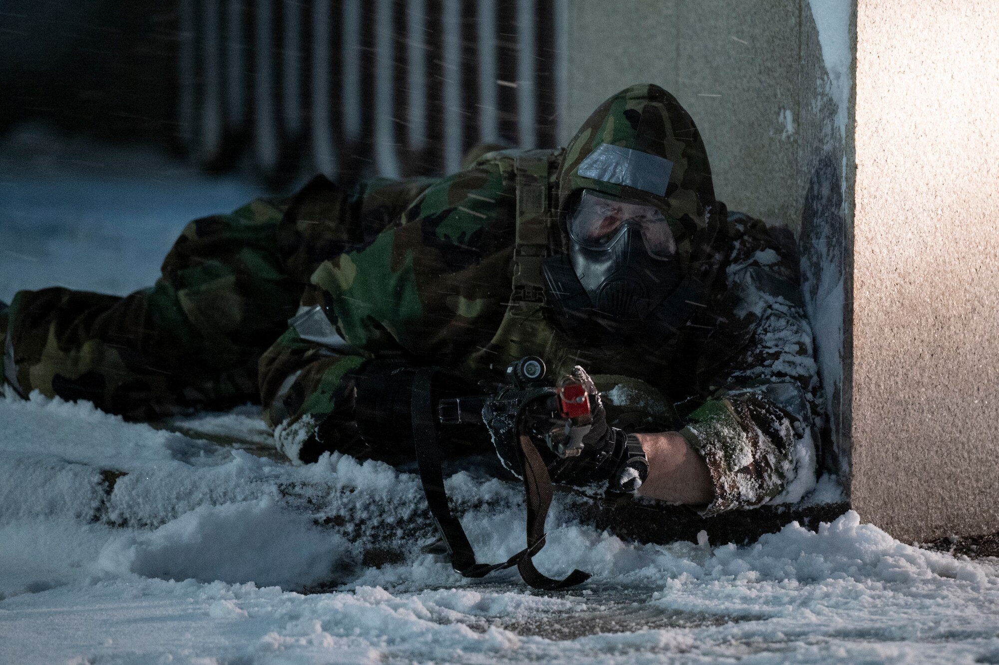 U.S. Air Force Master Sgt. Geoffrey Nesbit, 51st Security Forces Squadron flight chief, takes cover from a simulated ground attack during Beverly Herd 25-2 at Osan Air Base, Republic of Korea, Jan. 27, 2025.