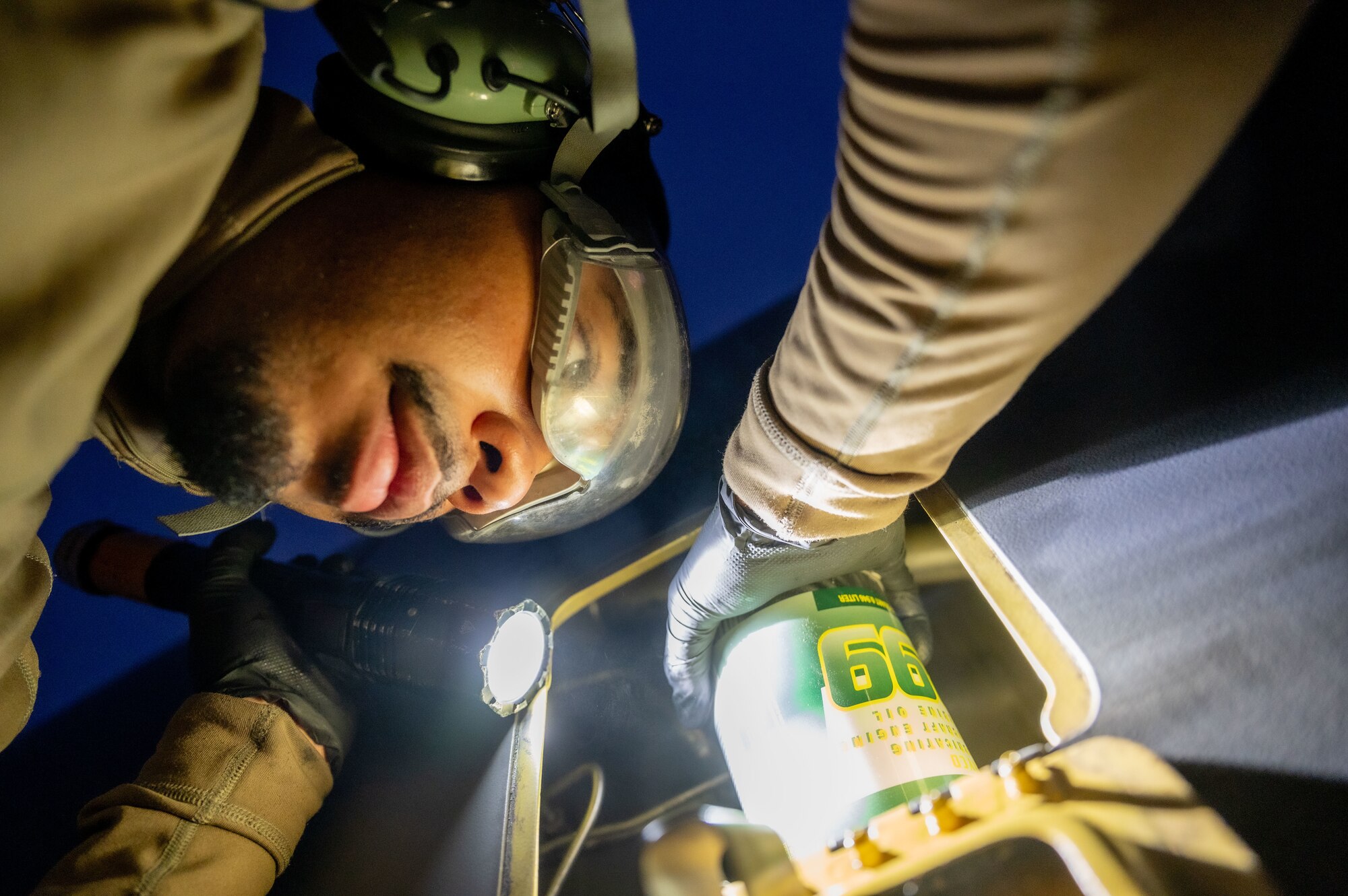 U.S. Air Force Senior Airman Joshua Hardman, 97th Expeditionary Air Refueling Squadron crew chief, changes the oil in a KC-135 Stratotanker engine within the U.S. Central Command area of responsibility, Jan. 23, 2025.