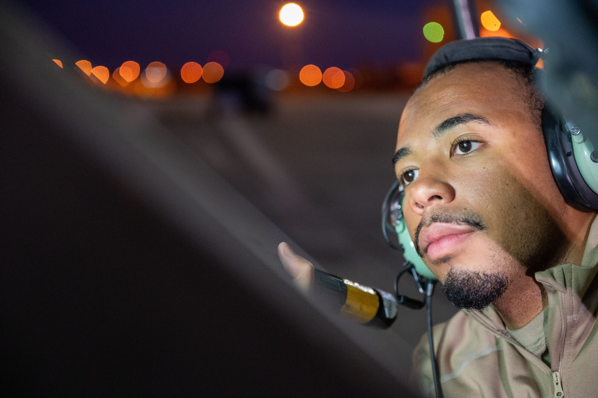 U.S. Air Force Senior Airman Joshua Hardman, 97th Expeditionary Air Refueling Squadron crew chief, performs an inspection of a panel on the KC-135 Stratotanker within the U.S. Central Command area of responsibility, Jan. 23, 2025.