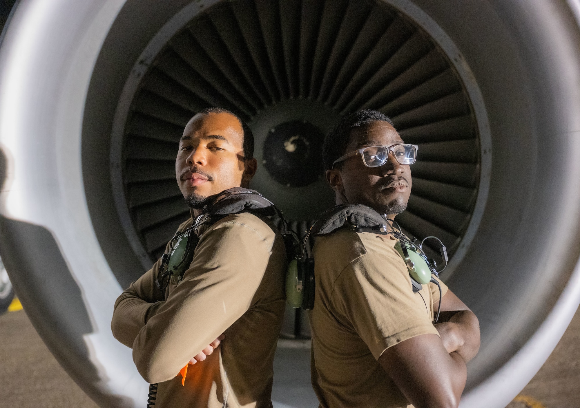 U.S. Air Force Senior Airman Joshua Hardman (left) and U.S. Air Force Staff Sgt.Tevin Patterson (right), 97th Expeditionary Air Refueling Squadron crew chiefs, pose for a photo within the U.S. Central Command area of responsibility, Jan. 23, 2025.
