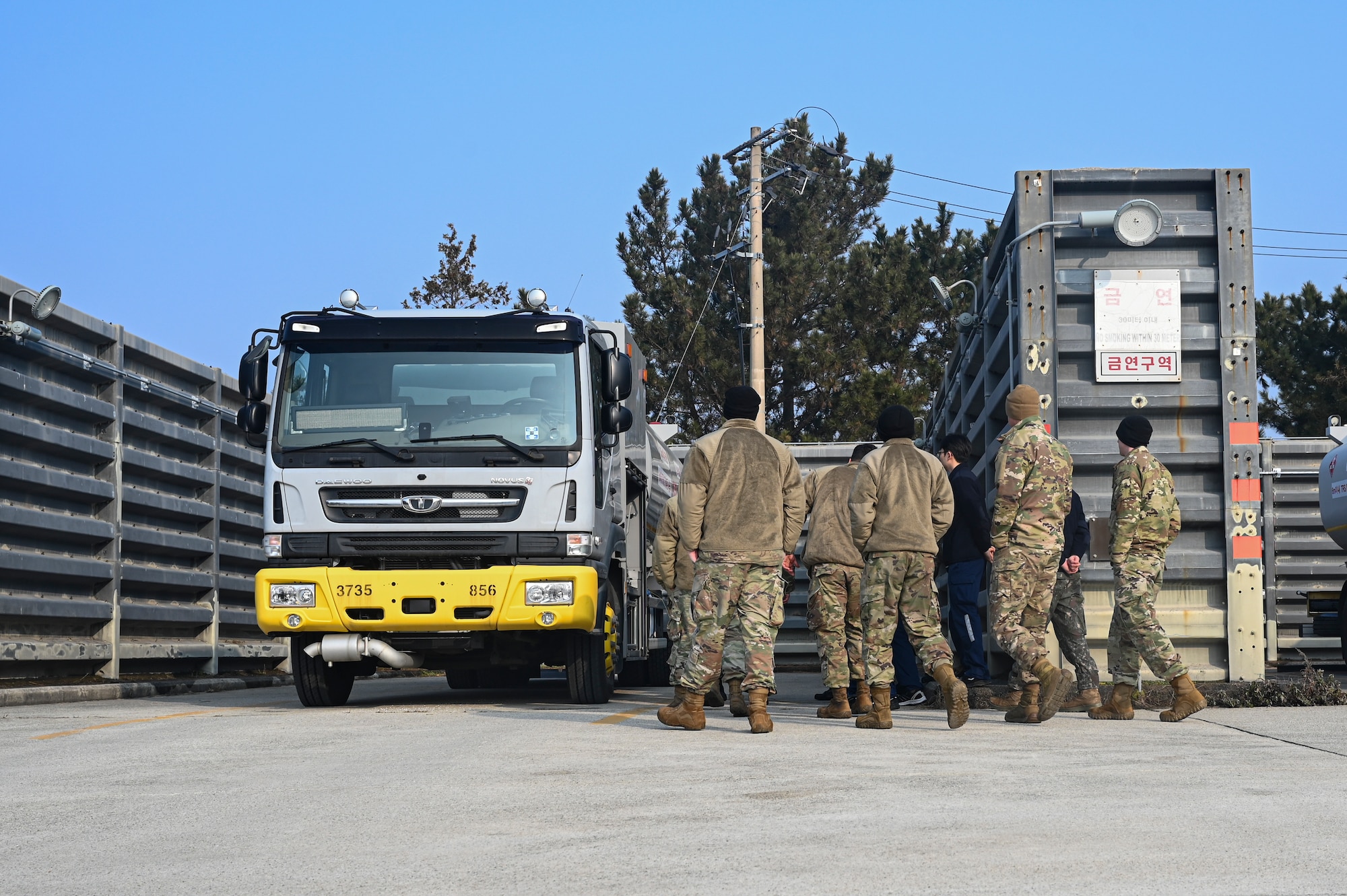 Airmen assigned to the 8th Logistics Readiness Squadron petroleum, oils, and lubricants flight, examine a new Republic of Korea Air Force aircraft refueling unit