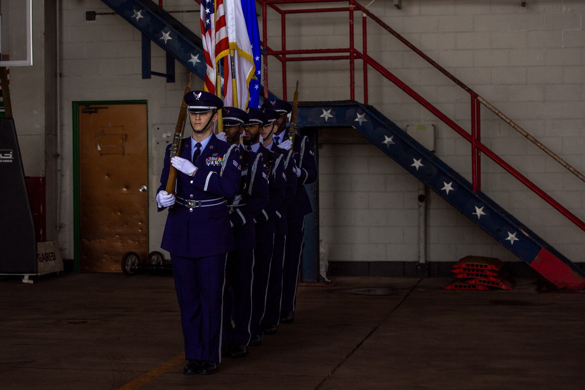 Members of the Kadena Honor Guard present the colors during the 33rd Rescue Generation Squadron activation ceremony at Kadena Air Base, Jan. 24, 2025.