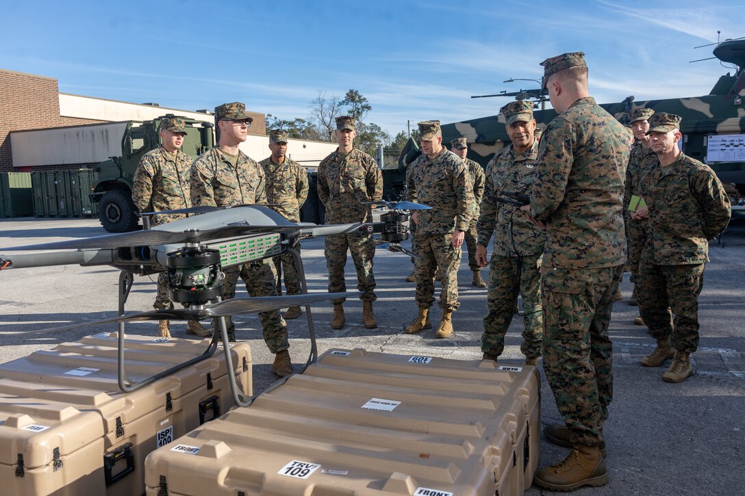 U.S. Marines with Combat Logistics Battalion 8, Combat Logistics Regiment 2, 2nd Marine Logistics Group, brief Lt. Gen. Calvert Worth, commanding general II Marine Expeditionary Force, on the capabilities of the TRV-150 during his tour of 2nd MLG on Camp Lejeune, North Carolina, Jan. 15, 2024. During his visit, Gen. Worth engaged with Marines of 2nd MLG and received a tour of various facilities that featured innovation efforts and emerging technologies.  (U.S. Marine Corps photo by Cpl. Christian Salazar)