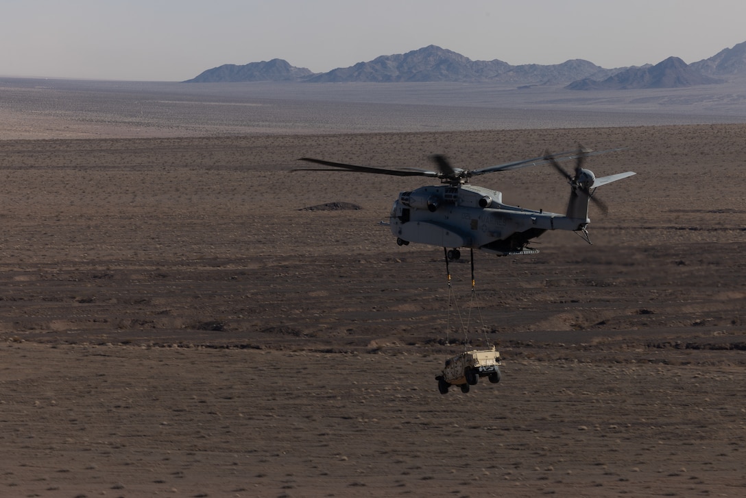 U.S. Marines with Marine Heavy Helicopter Squadron (HMH) 461 conduct an external lift flight at Marine Corps Air Ground Combat Center Twentynine Palms, California, Jan. 23, 2025. HMH-461 and other squadrons assigned to 2nd Marine Aircraft Wing trained to integrate with and support Marine ground units during Service Level Training Event (SLTE) 1-25, a series of training events designed to prepare Marines for operations around the globe. (U.S. Marine Corps photo by Cpl. Anakin Smith)