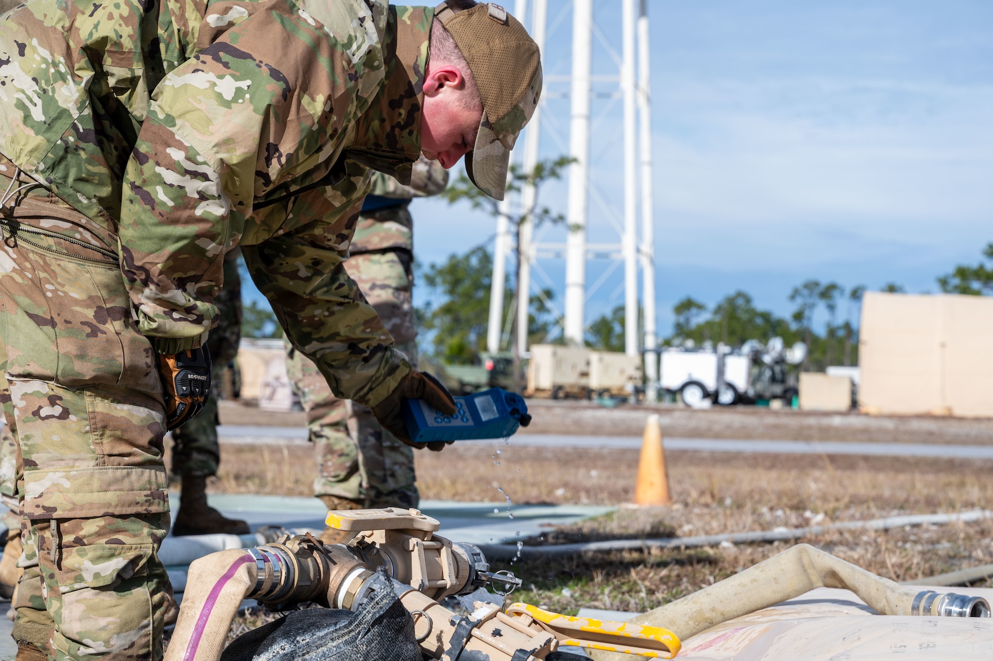 A U.S. Airman assigned to the 11th Air Task Force measures the chemical and mineral levels present in a newly established water supply at Tyndall Air Force Base, Florida, Jan. 21, 2025. Taking proper measurements ensured that the water supply was safe for use. (U.S. Air Force photo by Senior Airman Jasmyne Bridgers-Matos)