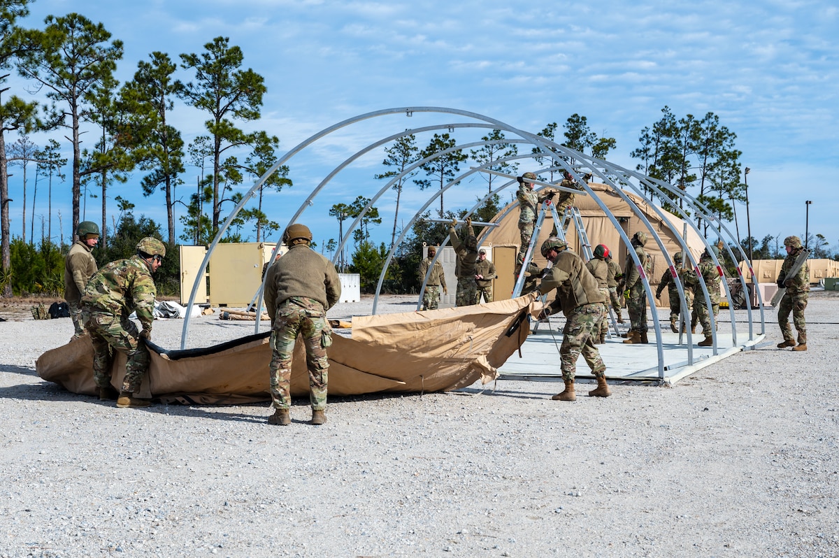 U.S. Airmen assigned to the 11th Air Task Force construct a tent at Tyndall Air Force Base, Florida, Jan. 21, 2025. The ability to set up a bare base capable of supporting the mission allows the 11th ATF to conduct operations in austere environments. (U.S. Air Force photo by Senior Airman Jasmyne Bridgers-Matos)