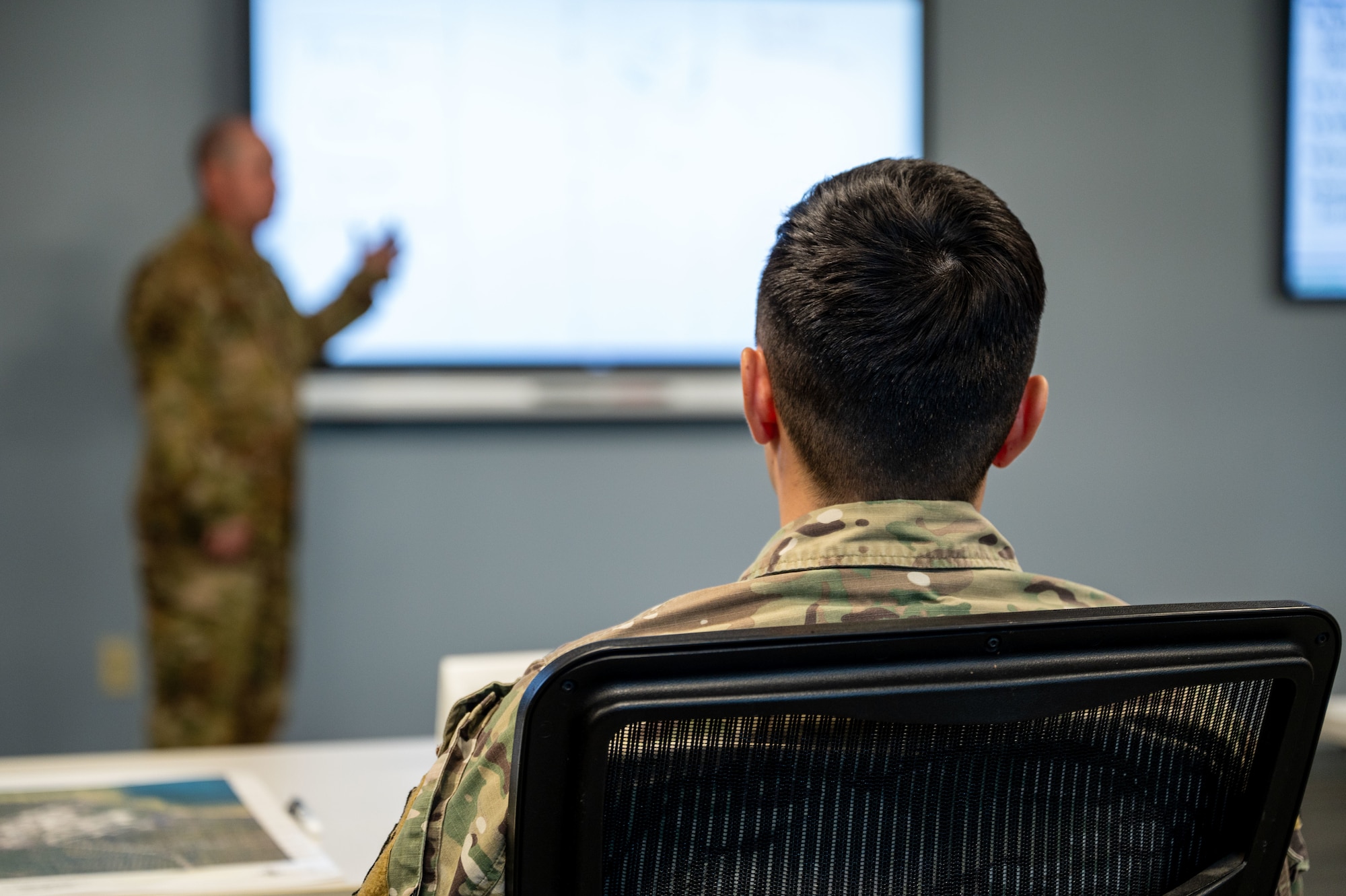 A U.S. Airman assigned to the 11th Air Task Force listens to a briefing by a fellow 11th ATF member on how to conduct personnel rescue and incident mitigation operations at Tyndall Air Force Base, Florida, Jan. 23, 2025. The 11th ATF trains as a combat unit of action in preparation for deployment, strengthening U.S. force readiness in the Great Power Competition. (U.S. Air Force photo by Senior Airman Jasmyne Bridgers-Matos)