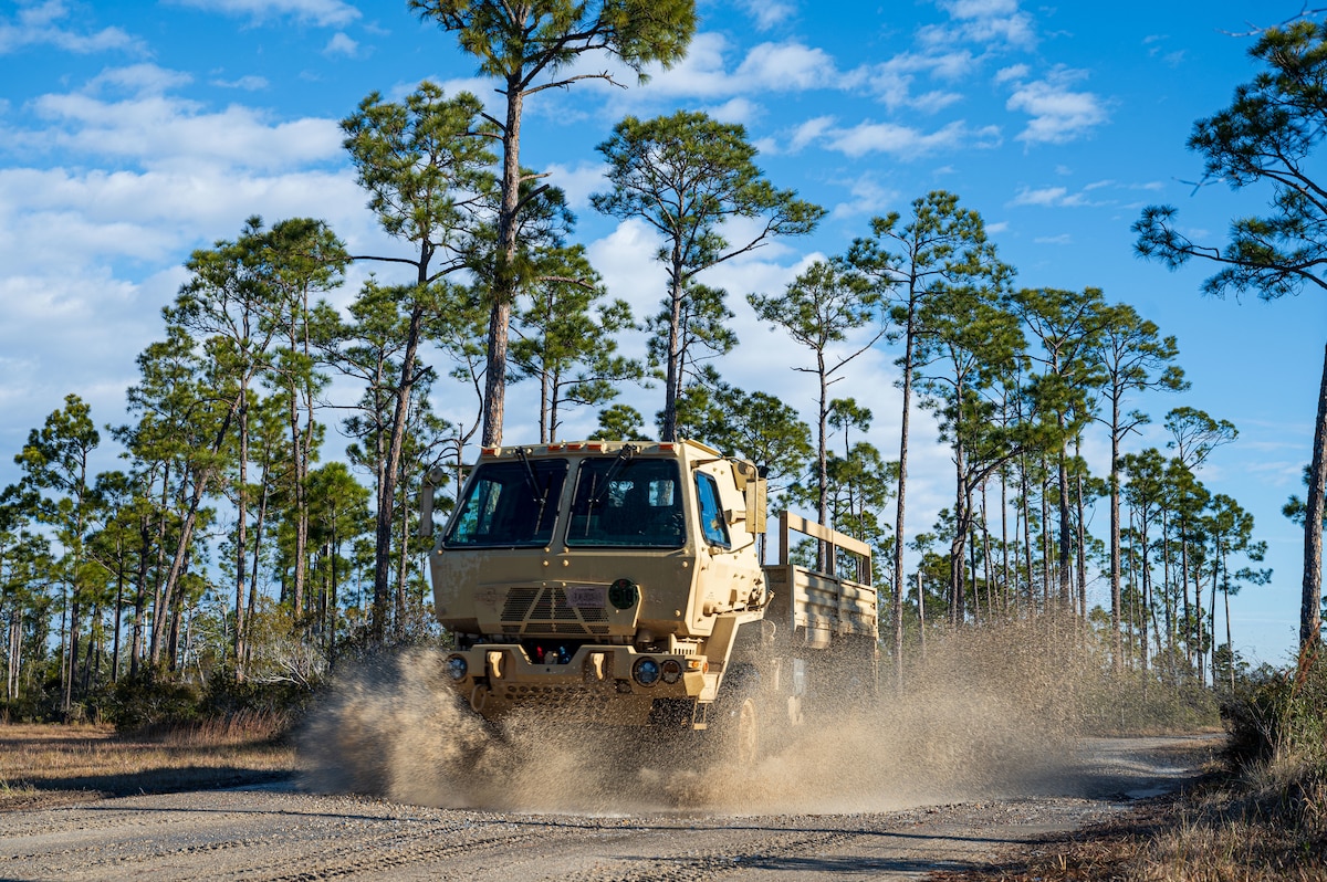 A U.S. Airman assigned to the 11th Air Task Force drives a light medium tactical vehicle to the convoy training site at Tyndall Air Force Base, Florida, Jan. 24, 2025. The training provided Airmen across various career fields experience driving large vehicles in different formations. (U.S. Air Force photo by Senior Airman Jasmyne Bridgers-Matos)