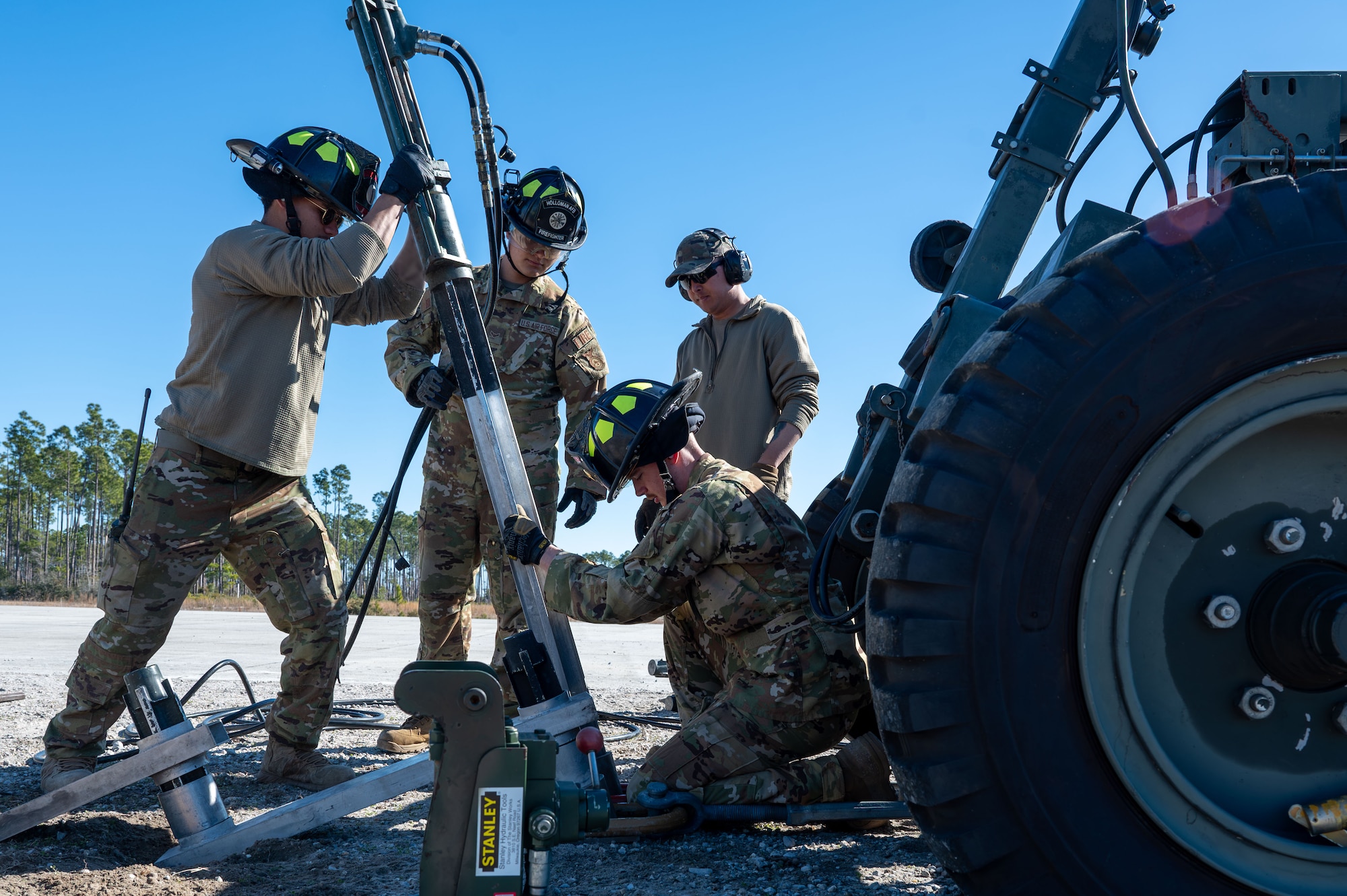 U.S. Airmen assigned to the 11th Air Task Force set up an aircraft arresting system at Tyndall Air Force Base, Florida, Jan. 26, 2025. An aircraft arresting system is a mechanical device that stops an aircraft from overrunning a runway. (U.S. Air Force photo by Senior Airman Jasmyne Bridgers-Matos)