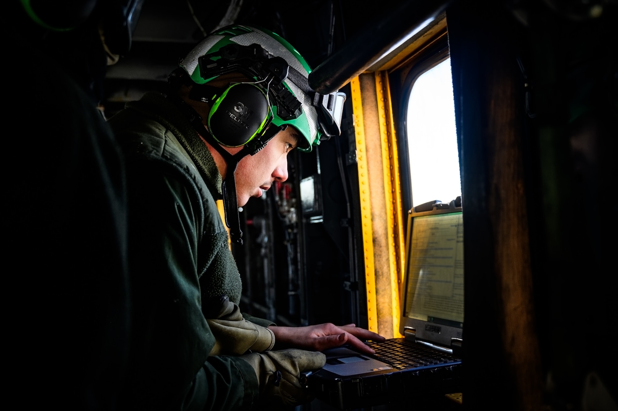 U.S. Marine Corps Cpl. Ryan Ewing, Marine Heavy Helicopter Squadron 772 helicopter crew chief, prepares a CH-53E Super Stallion helicopter for takeoff at Joint Base McGuire-Dix-Lakehurst, N.J., Jan. 22, 2025. The helicopter was requested on behalf of the Pennsylvania Army National Guard to lift and relocate nine Stryker armored vehicles to the Fort Indiantown Gap training range. The lift was assisted by a team of U.S. Air Force Airmen assigned to the 621st Contingency Response Group who secured and released each Stryker to the helicopter. (U.S. Air Force photo by Senior Airman Matt Porter)