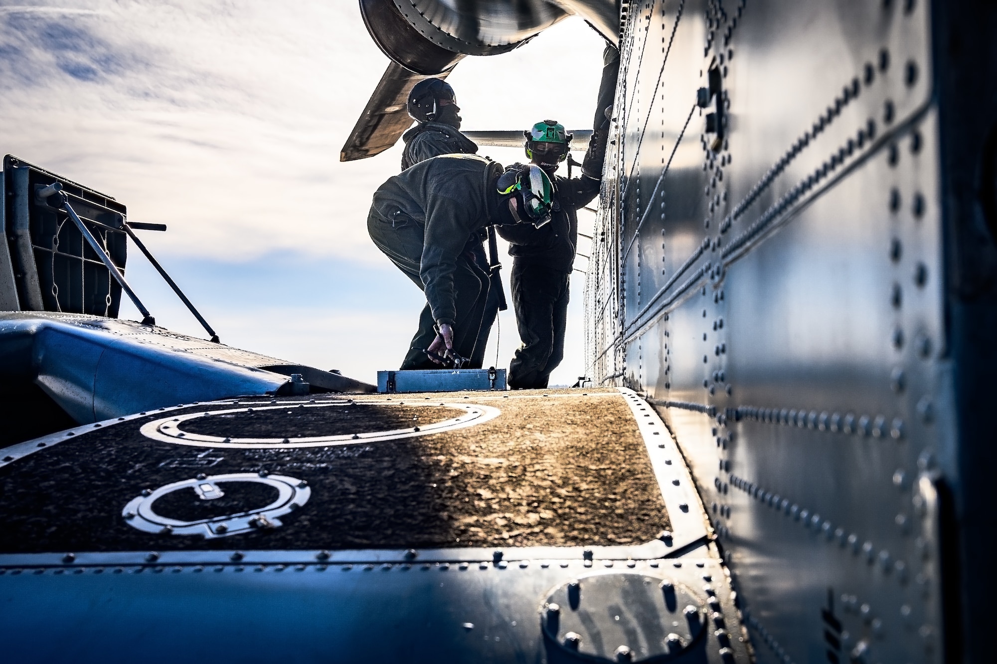 U.S. Marine Corps Marines assigned to Marine Heavy Helicopter Squadron 772, perform a maintenance check on a CH-53E Super Stallion helicopter before takeoff at Joint Base McGuire-Dix-Lakehurst, N.J., Jan. 22, 2025. The helicopter was requested on behalf of the Pennsylvania Army National Guard to lift and relocate nine Stryker armored vehicles to the Fort Indiantown Gap training range. The lift was assisted by a team of U.S. Air Force Airmen assigned to the 621st Contingency Response Group who secured and released each Stryker to the helicopter. (U.S. Air Force photo by Senior Airman Matt Porter)