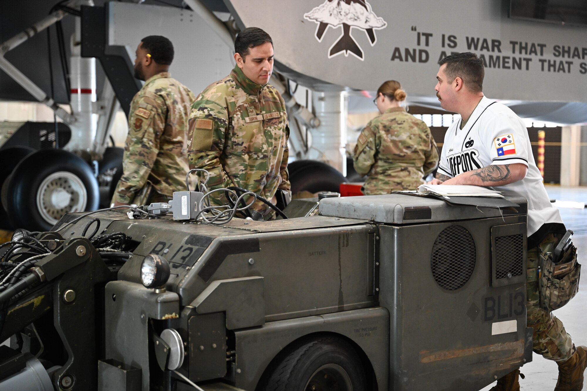 U.S. Air Force 28th Bomber Generation Squadron, load crew members, prepare to load a guided bomb unit, during the Lone Star Challenge at Dyess Air Force Base, Texas, Jan. 24, 2025. The competition replicates a deployed setting where load crews showcase their speed and efficiency in loading aircraft. (U.S. Air Force photo by Airman Caleb Schellenberg)