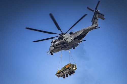 A CH-53E Super Stallion helicopter assigned to Marine Heavy Helicopter Squadron 772 relocates a Stryker armored vehicle at Fort Indiantown Gap, P.A., Jan. 22, 2025. The helicopter was requested on behalf of the Pennsylvania Army National Guard to lift and relocate nine Stryker armored vehicles to the Fort Indiantown Gap training range. The lift was assisted by a team of U.S. Air Force Airmen assigned to the 621st Contingency Response Group who secured and released each Stryker to the helicopter. (U.S. Air Force photo by Senior Airman Matt Porter)