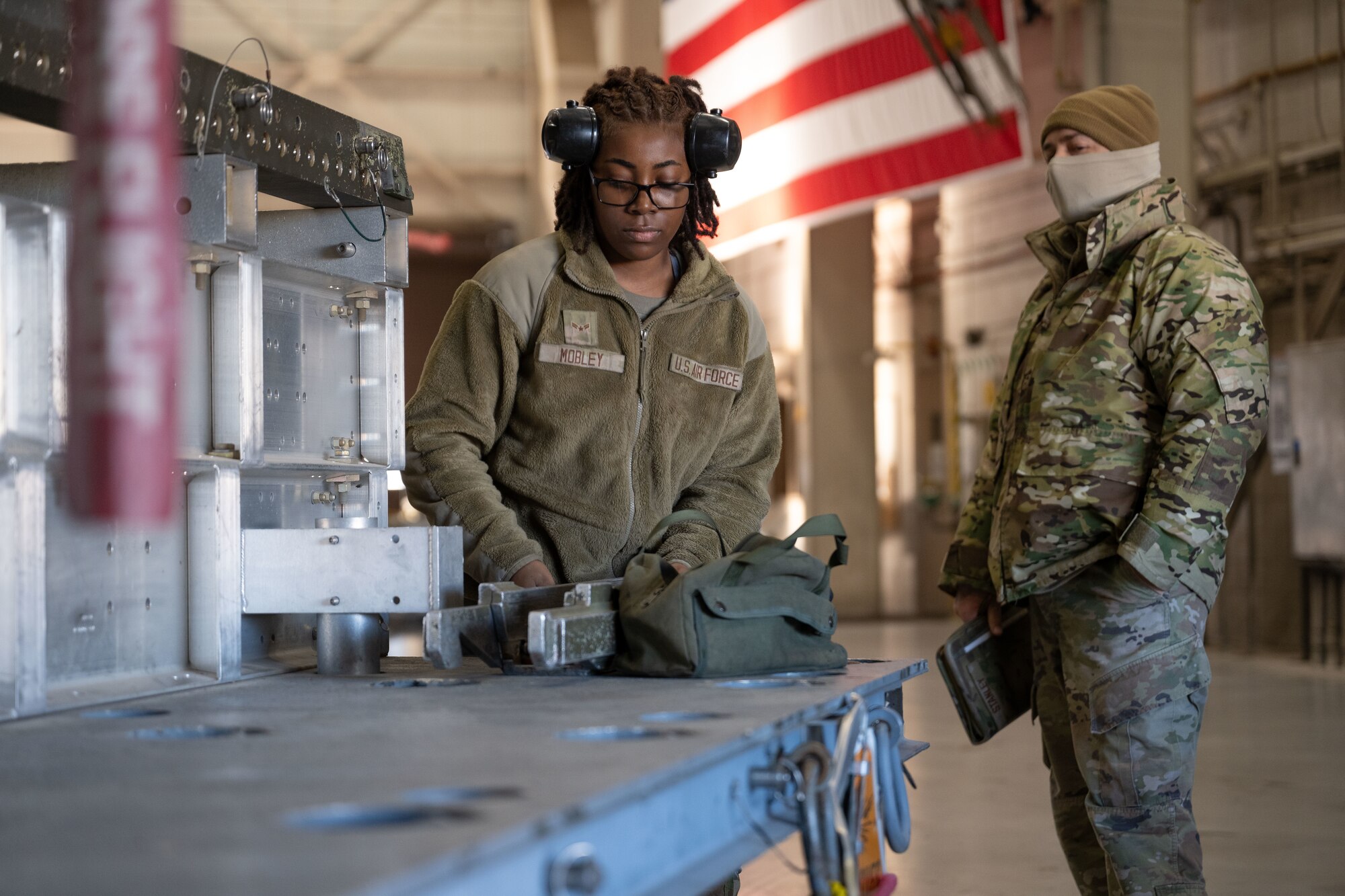 U.S. Air Force Airman 1st Class Jabriya Mobley, 28th Bomber Generation Squadron load crew member, prepares to load a guided bomb unit, during the Lone Star Challenge at Dyess Air Force Base, Texas, Jan. 24, 2025. During the annual loading competition, two teams competed to honor the Wing’s best load crew of the year, showcasing their skills for potential real-world scenarios. (U.S. Air Force photo by Senior Airman Emma Anderson)
