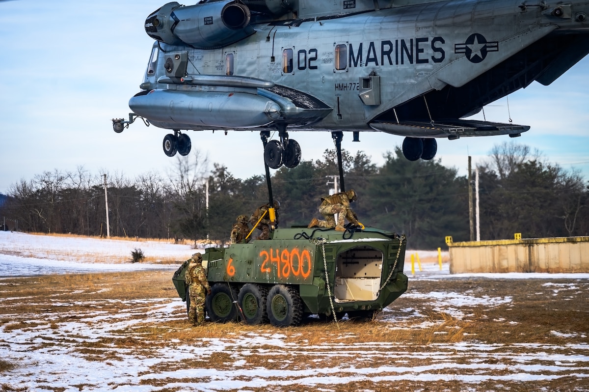 U.S. Air Force Airmen assigned to the 621st Contingency Response Group secure a Stryker heavy vehicle to a CH-53E Super Stallion helicopter assigned to Marine Heavy Helicopter Squadron 772 at Fort Indiantown Gap, P.A., Jan. 22, 2025. The 621st CRG was requested on behalf of the Pennsylvania Army National Guard to help lift and relocate nine Stryker armored vehicles to the Fort Indiantown Gap training range. The lift was assisted by a team of U.S. Air Force Airmen assigned to the 621st Contingency Response Group who secured and released each Stryker to the helicopter. (U.S. Air Force photo by Senior Airman Matt Porter)