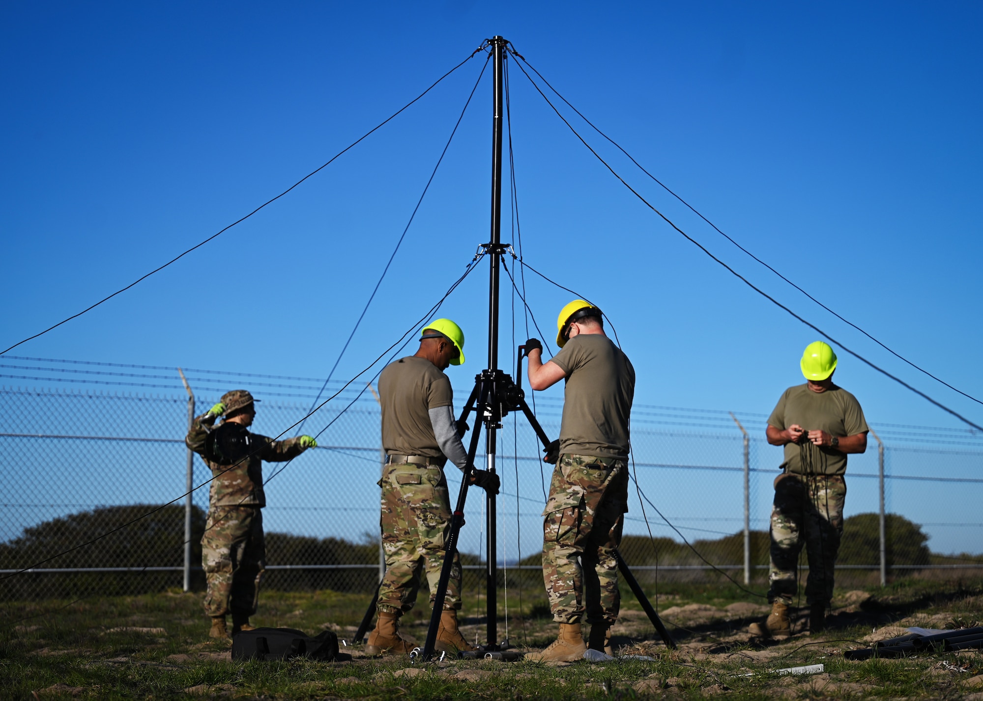 Participants of Operation Inception set up the BlueSky Mast antenna system during training.