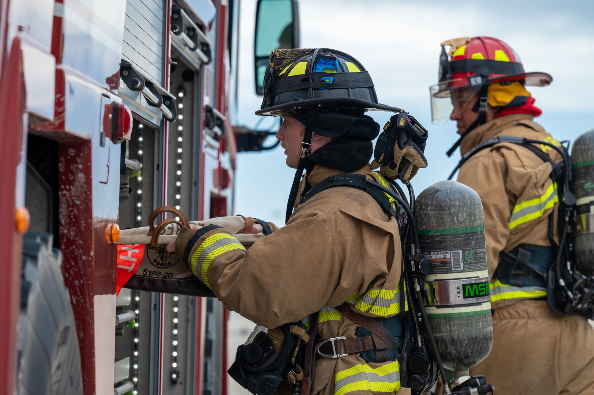 U.S. Airmen assigned to the 11th Air Task Force prepare to respond to an aircraft that was stopped using an aircraft arresting system at Tyndall Air Force Base, Florida, Jan. 27, 2025. First responders arrived to clear the scene of an emergency landing on the flight line. (U.S. Air Force photo by Senior Airman Jasmyne Bridgers-Matos)