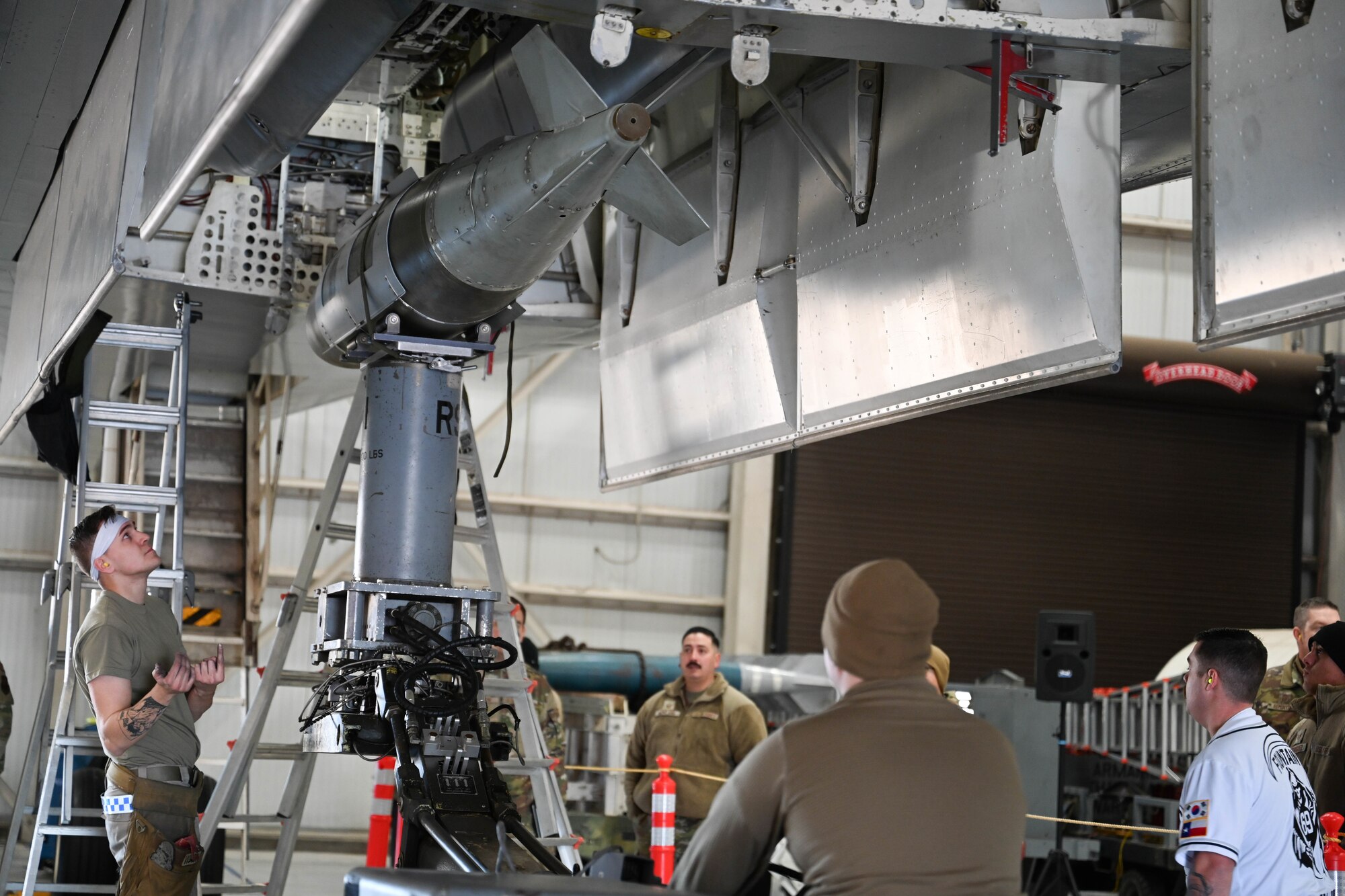 U.S. Air Force 28th Bomber Generation Squadron load crew members, load a guided bomb unit, during the Lone Star Challenge at Dyess Air Force Base, Texas, Jan. 24, 2025. The competition highlights the weapons crew's advanced skills in precise loading operations. (U.S. Air Force photo by Airman Caleb Schellenberg)
