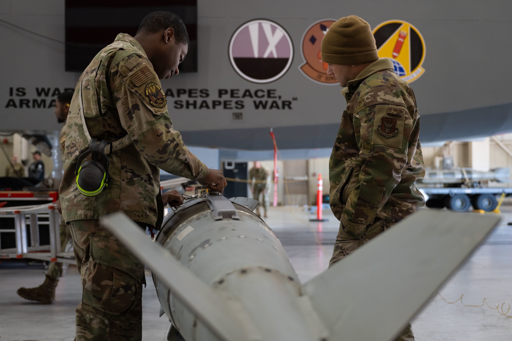 U.S. Air Force Airman 1st Class Demariyon Bolden, 9th Bomber Generation Squadron load crew member, prepares to load a guided bomb unit, during the Lone Star Challenge at Dyess Air Force Base, Texas, Jan. 24, 2025. Completing challenges like this ensures Airmen are maintaining operational readiness and support capabilities to meet U.S. security obligations. (U.S. Air Force photo by Senior Airman Emma Anderson)
