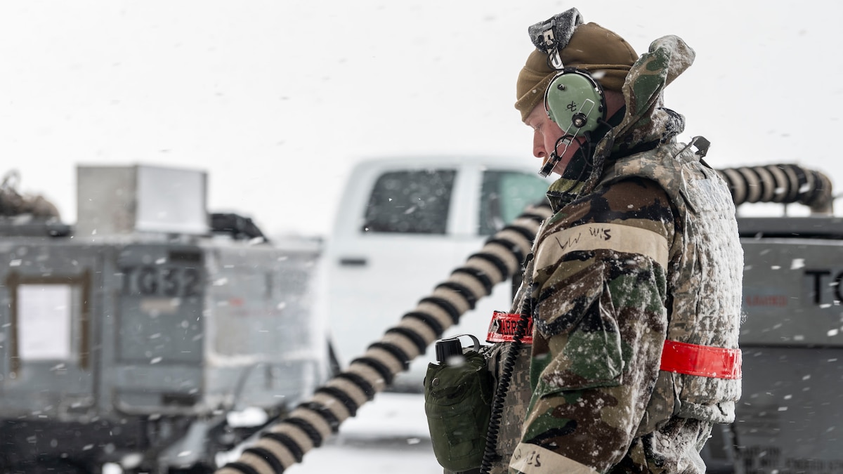 U.S. Air Force Staff Sgt. Tyson Rogers, 36th Fighter Generation Squadron avionics technician, communicates via headset with his counterpart during a jet inspection at Kunsan Air Base, Republic of Korea, Jan. 28, 2025.