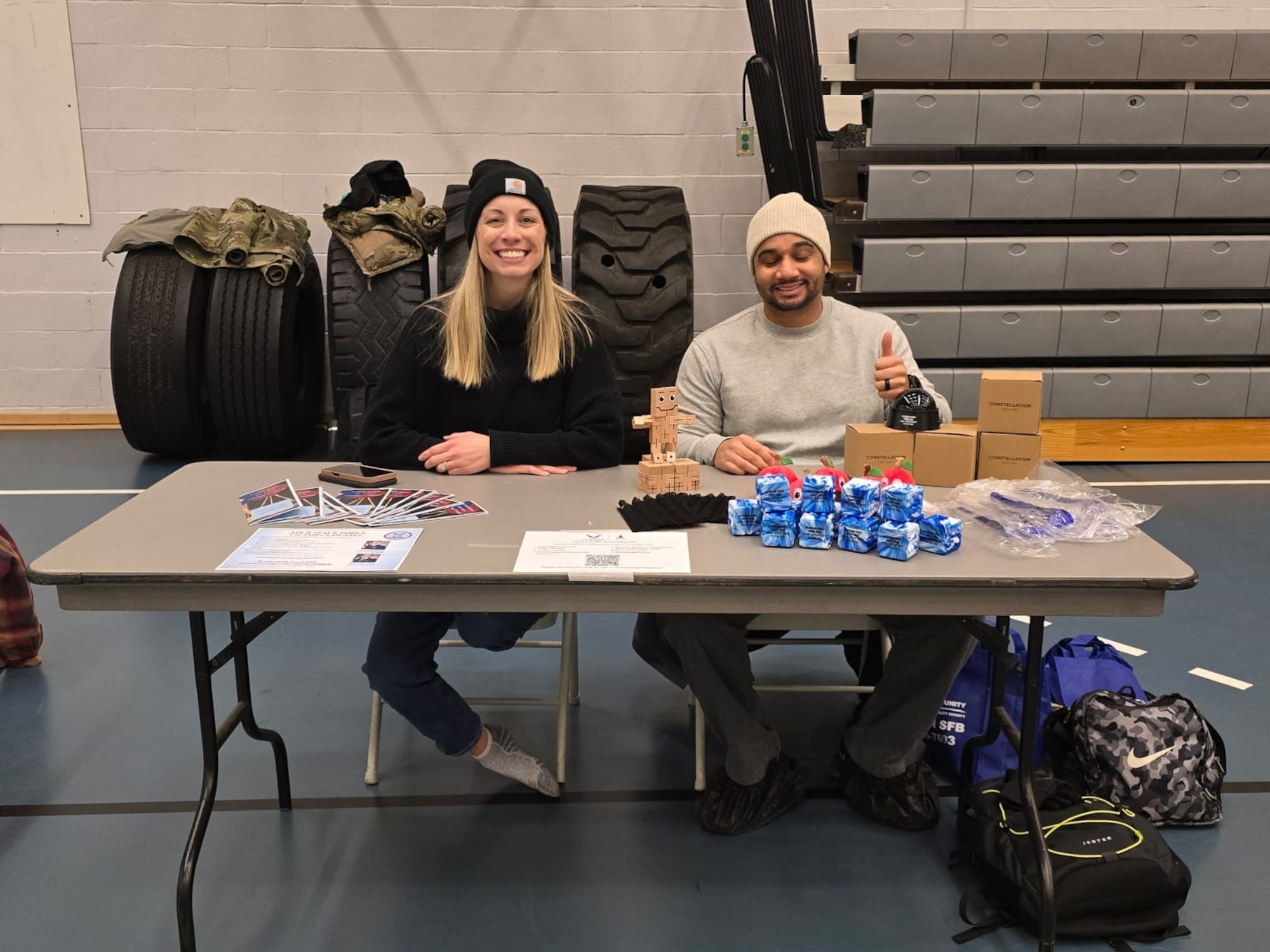 Two members sit behind their desk for the resilience fair