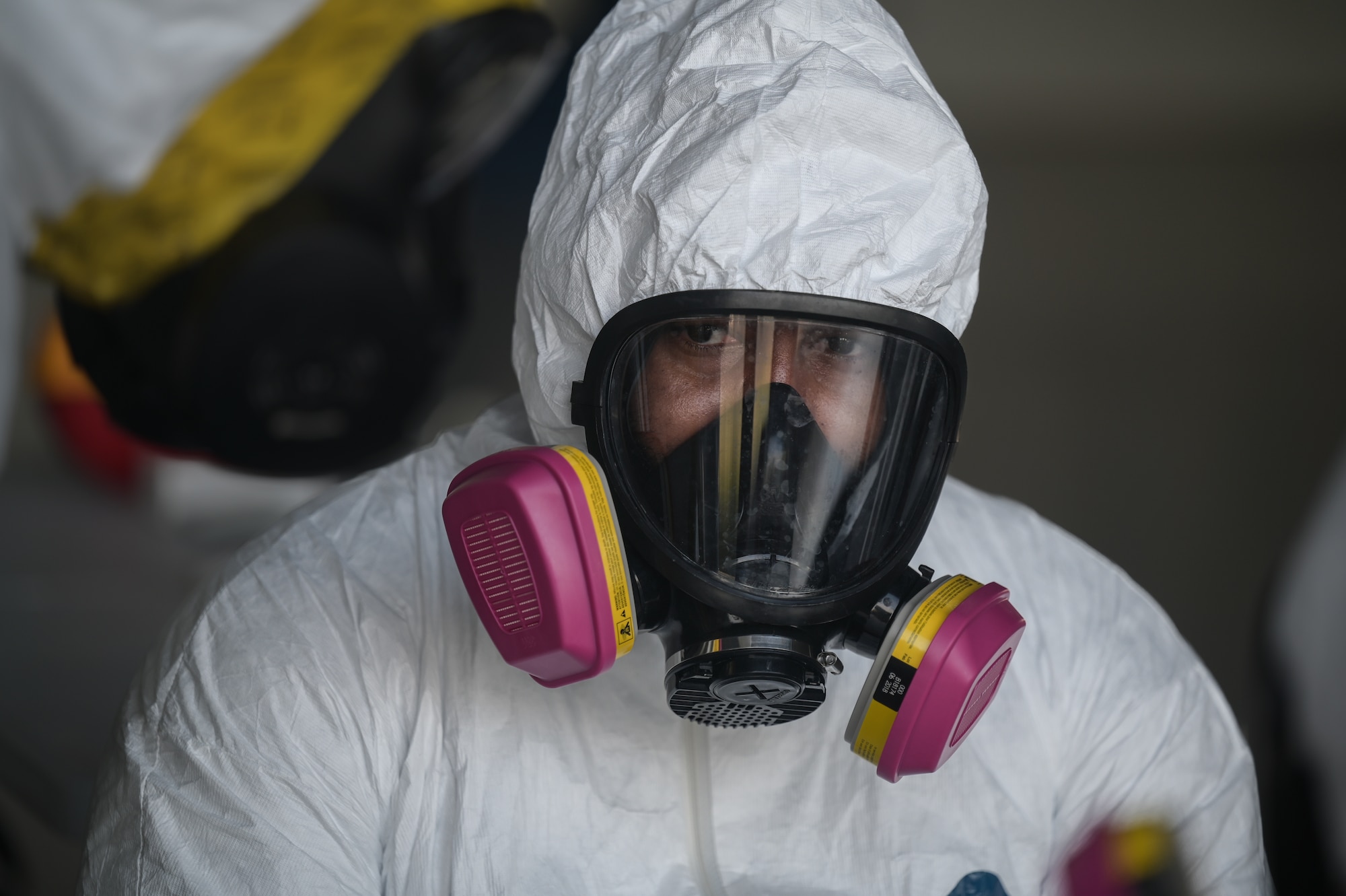 Close up photo of Airman in chemical protective equipment.