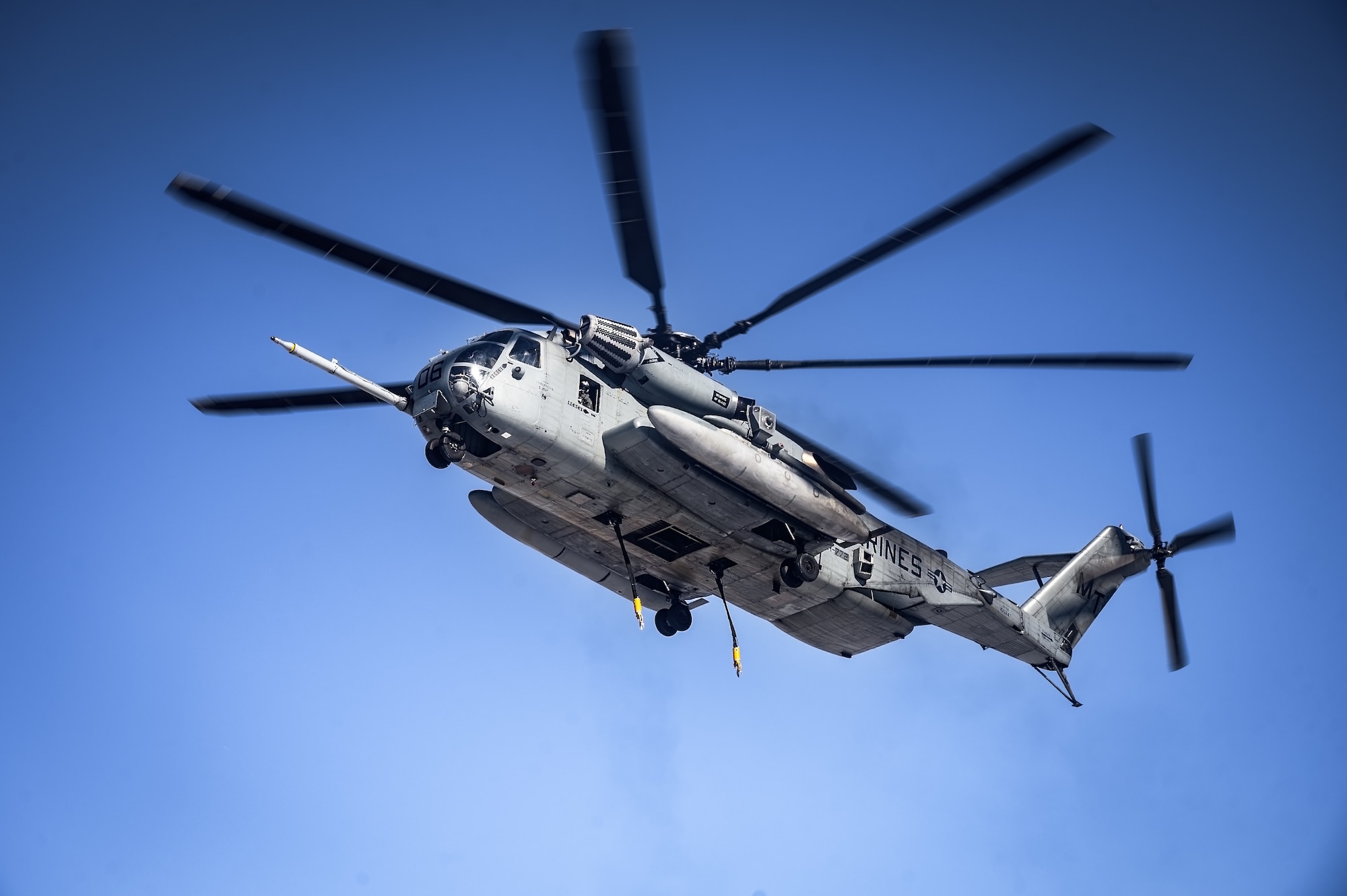 A CH-53E Super Stallion helicopter assigned to Marine Heavy Helicopter Squadron 772 prepares to land at Fort Indiantown Gap, P.A., Jan. 22, 2025. The helicopter was requested on behalf of the Pennsylvania Army National Guard to lift and relocate nine Stryker armored vehicles to the Fort Indiantown Gap training range. The lift was assisted by a team of U.S. Air Force Airmen assigned to the 621st Contingency Response Group who secured and released each Stryker to the helicopter. (U.S. Air Force photo by Senior Airman Matt Porter)