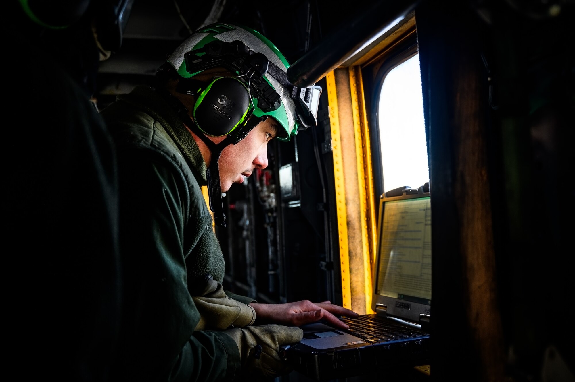 U.S. Marine Corps Cpl. Ryan Ewing, Marine Heavy Helicopter Squadron 772 helicopter crew chief, prepares a CH-53E Super Stallion helicopter for takeoff at Joint Base McGuire-Dix-Lakehurst, N.J., Jan. 22, 2025. The helicopter was requested on behalf of the Pennsylvania Army National Guard to lift and relocate nine Stryker armored vehicles to the Fort Indiantown Gap training range. The lift was assisted by a team of U.S. Air Force Airmen assigned to the 621st Contingency Response Group who secured and released each Stryker to the helicopter. (U.S. Air Force photo by Senior Airman Matt Porter)