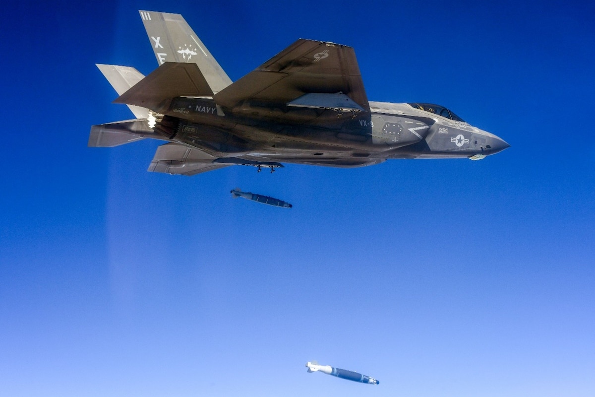 An F-35C aircraft does a dual, external release of a GBU-54 Laser Joint Direct Attack Munition.