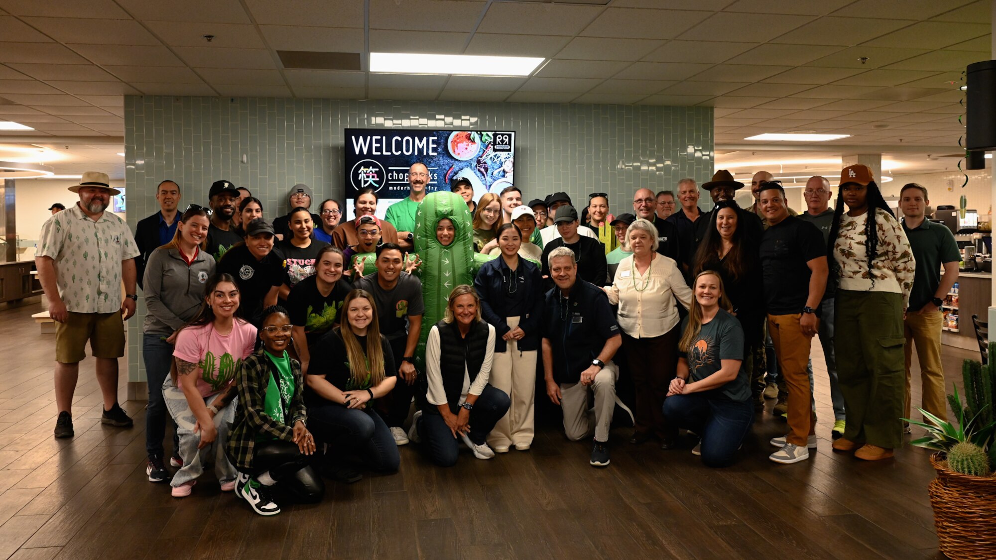 Members from across the installation pose for a group photo during the John L. Hennessy inspection at Davis-Monthan Air Force Base, Arizona, Jan. 26, 2025. The dining facility was evaluated based on food service management, food quality, mission support, safety, and training. (U.S. Air Force photo by Senior Airman Andrew Garavito)
