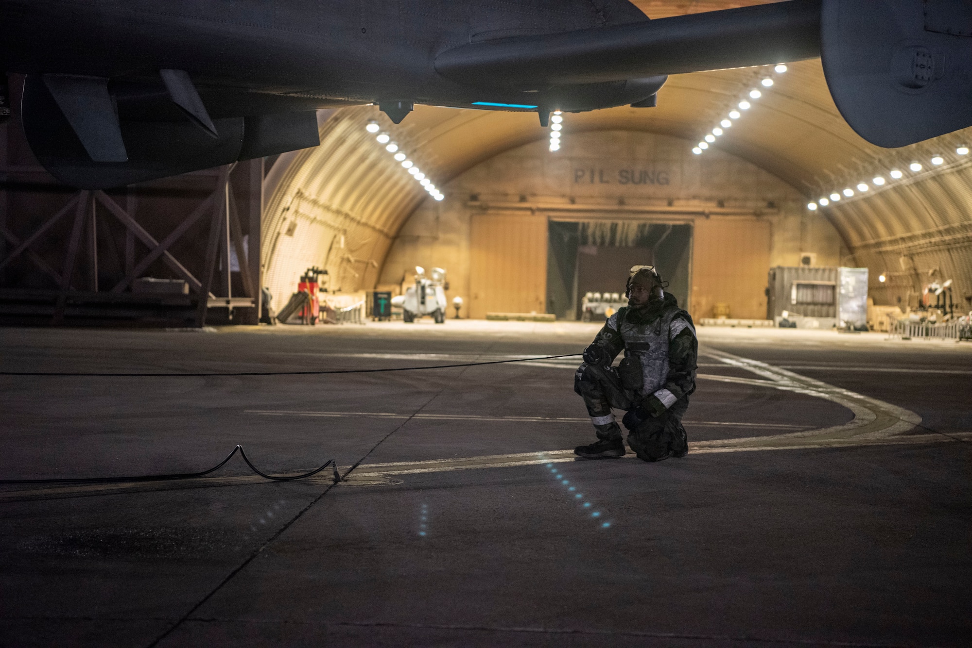U.S. Air Force Senior Airman Eimaj Davis, 25th Fighter Generation Squadron dedicated crew chief, checks the control surface response of an A-10 Thunderbolt II during Beverly Herd 25-2 at Osan Air Base, Republic of Korea, Jan. 30, 2025. The 51st Fighter Wing regularly conducts Beverly Herd exercises to ensure the ability to survive and operate in a contested environment. (U.S. Air Force photo by Staff Sgt. Jason W. Cochran)