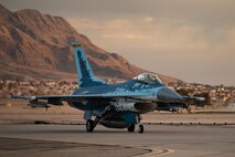 A U.S. Air Force F-16 Fighting Falcon assigned to 64th Aggressor Squadron, Nellis Air Force Base (AFB), Nevada, taxis in after a mission during Red Flag-Nellis 25-1, Jan. 27, 2025.