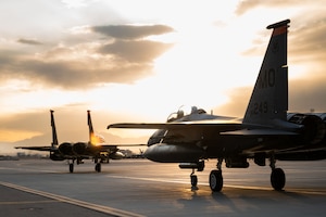 Two U.S. Air Force F-15E Strike Eagle assigned to 366th Fighter Wing, Mountain Home Air Force Base (AFB), Idaho, taxi in after a mission during Red Flag-Nellis 25-1, Jan. 27, 2025, at Nellis AFB, Nevada.