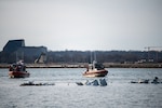Response boat crews from Coast Guard stations Washington, Curtis Bay, Annapolis, Oxford, and Crisfield enforce a safety zone around the incident scene in the Potomac River, January 30, 2025.