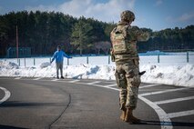 U.S. Air Force Senior Airman Devon Pena, 35th Security Force Squadron installation entry controller, grabs a simulated suspect's hands during an active shooter exercise at Misawa Air Base, Japan, Jan. 24, 2025. The 35th Fighter Wing prioritizes readiness, and exercises like these help Airmen sharpen their skills and prepare for any situation.