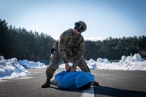 U.S. Air Force Senior Airman Devon Pena, 35th Security Force Squadron installation entry controller, grabs a simulated suspect's hands during an active shooter exercise at Misawa Air Base, Japan, Jan. 24, 2025. The 35th Fighter Wing prioritizes readiness, and exercises like these help Airmen sharpen their skills and prepare for any situation.