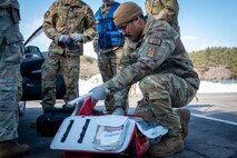 A U.S. Air Force Airman assigned to the 35th Civil Engineering Squadron prepares a first aid kit during an active shooter exercise at Misawa Air Base, Japan, Jan. 24, 2025. The exercise aimed to simulate emergency response procedures, ensuring the 35th Fighter Wing remains prepared for any contingency at a moment’s notice.