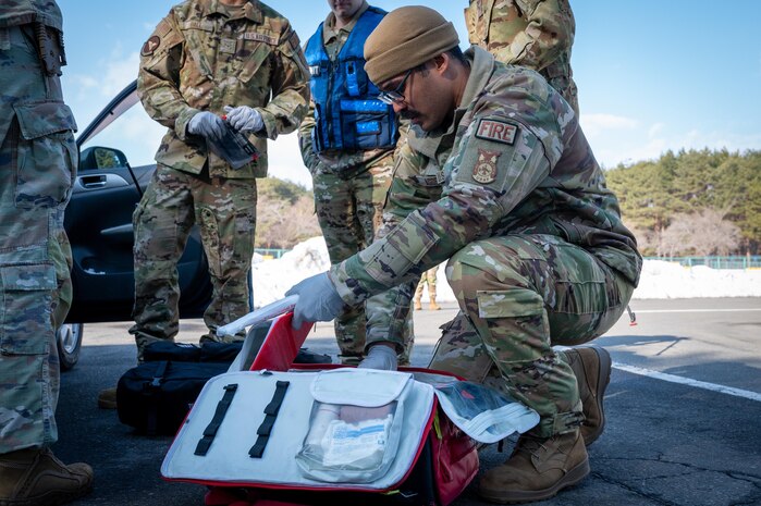 A U.S. Air Force Airman assigned to the 35th Civil Engineering Squadron prepares a first aid kit during an active shooter exercise at Misawa Air Base, Japan, Jan. 24, 2025. The exercise aimed to simulate emergency response procedures, ensuring the 35th Fighter Wing remains prepared for any contingency at a moment’s notice.