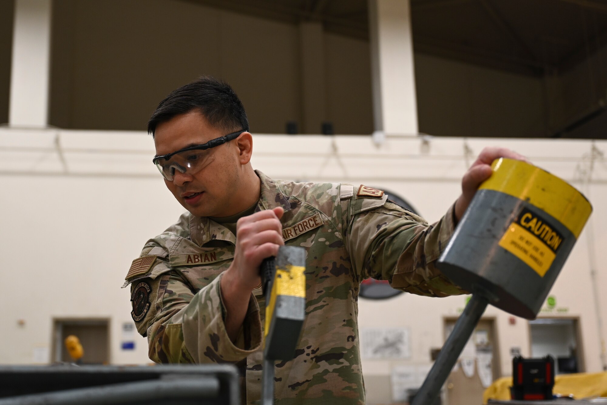 U.S. Air Force Tech. Sgt. Timothy Abian, 8th Maintenance Squadron aircraft structural maintenance section chief, operates a sheet metal bender at Kunsan Air Base, Republic of Korea.