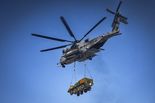 A CH-53E Super Stallion helicopter assigned to Marine Heavy Helicopter Squadron 772 relocates a Stryker armored vehicle at Fort Indiantown Gap, P.A., Jan. 22, 2025. The helicopter was requested on behalf of the Pennsylvania Army National Guard to lift and relocate nine Stryker armored vehicles to the Fort Indiantown Gap training range. The lift was assisted by a team of U.S. Air Force Airmen assigned to the 621st Contingency Response Group who secured and released each Stryker to the helicopter. (U.S. Air Force photo by Senior Airman Matt Porter)