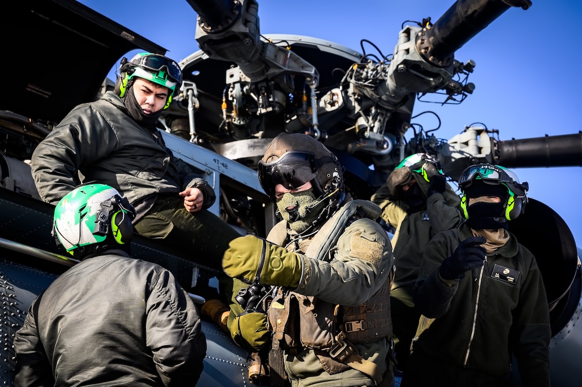 U.S. Marine Corps Marines assigned to Marine Heavy Helicopter Squadron 772, perform a maintenance check on a CH-53E Super Stallion helicopter before takeoff at Joint Base McGuire-Dix-Lakehurst, N.J., Jan. 22, 2025. The helicopter was requested on behalf of the Pennsylvania Army National Guard to lift and relocate nine Stryker armored vehicles to the Fort Indiantown Gap training range. The lift was assisted by a team of U.S. Air Force Airmen assigned to the 621st Contingency Response Group who secured and released each Stryker to the helicopter. (U.S. Air Force photo by Senior Airman Matt Porter)
