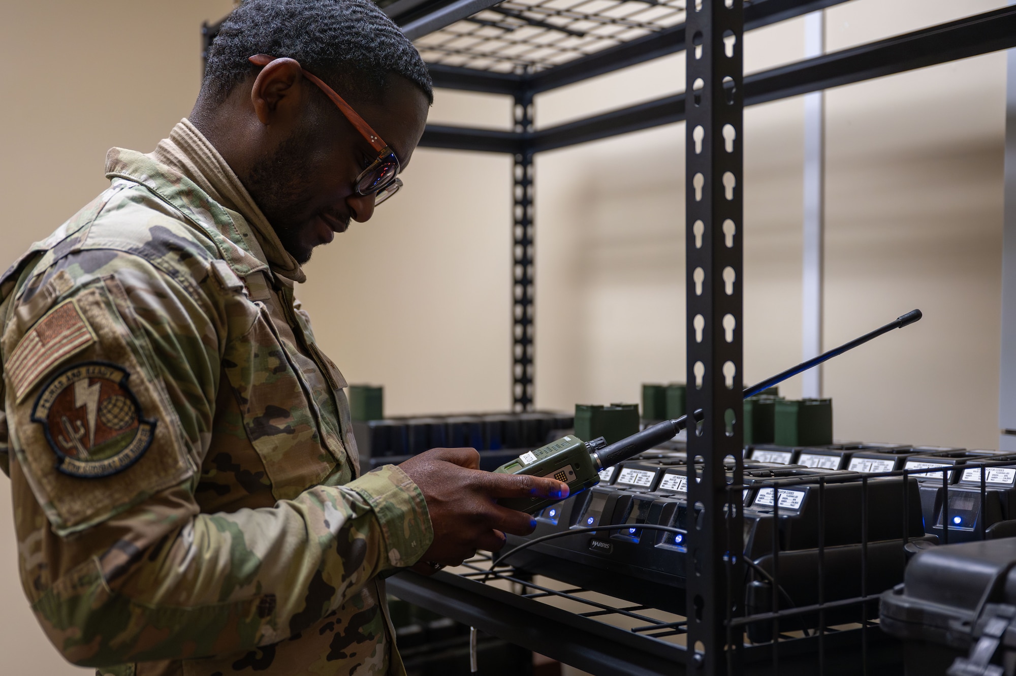 A U.S. Airman assigned to the 11th Air Task Force sets up radios at Tyndall Air Force Base, Florida, Jan. 26, 2025. Airmen ensured that proper communication channels were in place following a simulated severe weather event. (U.S. Air Force photo by Senior Airman Jasmyne Bridgers-Matos)